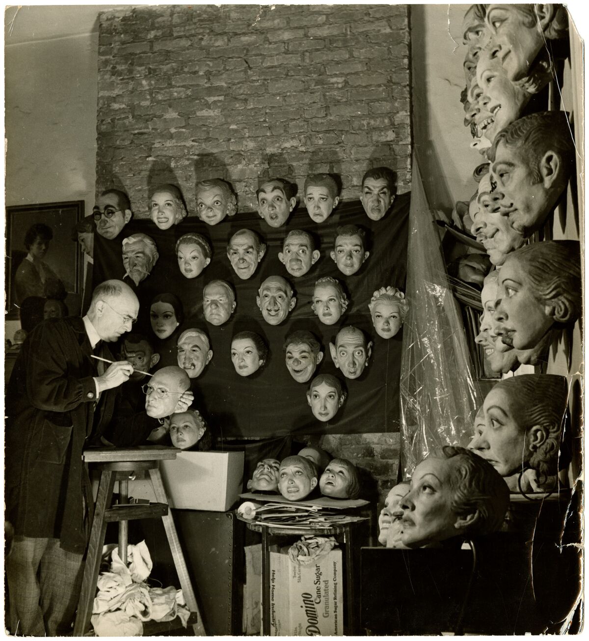 Doane Powell with wall of masks