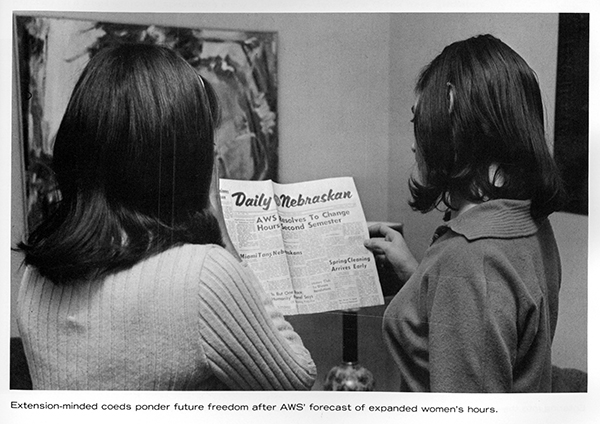 two women reading the Daily Nebraskan