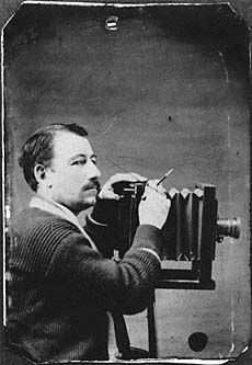 Solomon D. Butcher with camera