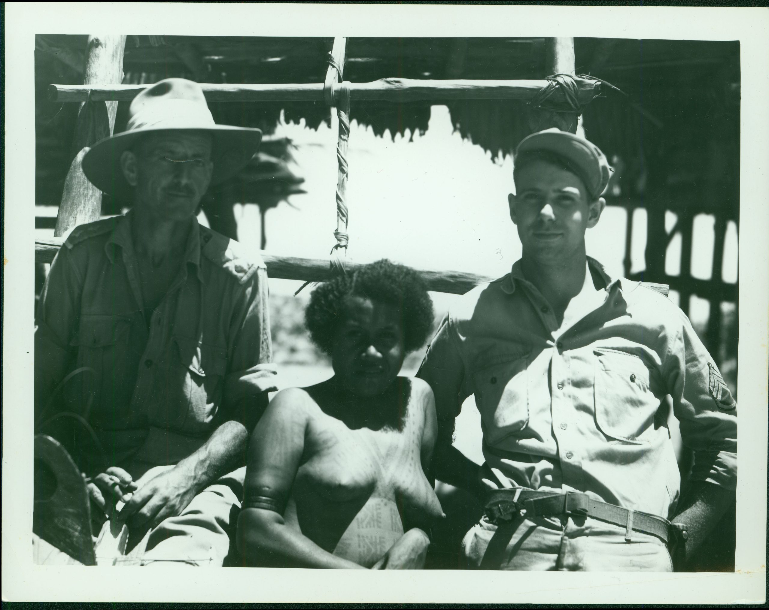 Merchant with Australian Lieutenant pose with native woman [RG5841-1-18]