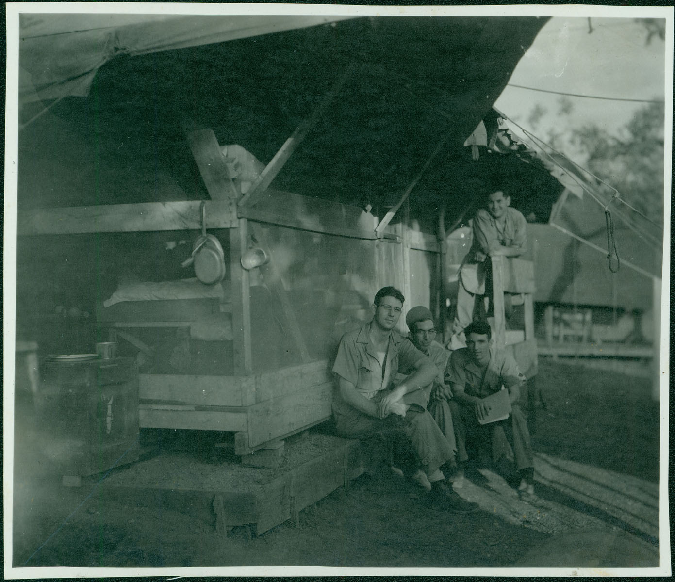 Merchant and friends outside living quarters [RG5841-9-8]