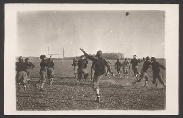John Nelson's black and white photograph on a postcard of football players. NSHS RG3542.PH:097-04