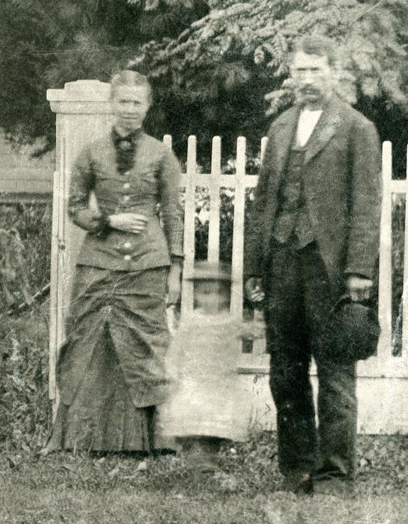 Susie and John Buck in front of their Sutton, Nebraska, home.
