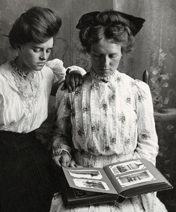  Unidentified women looking at photograph album, about 1907-1917 (RG3542.PH:069-02)