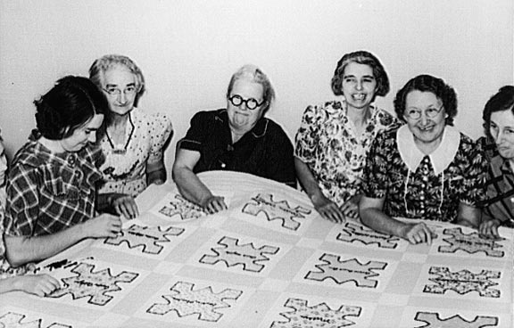 Ladies of the Helping Hand Society working on quilt, Gage County, Nebraska, October 1938. John Vachon, photographer 