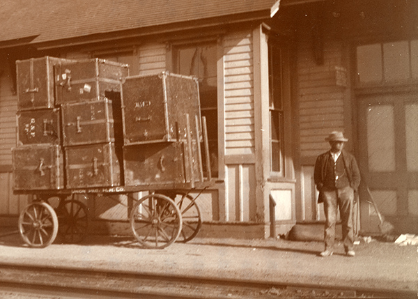 wagon stacked high with trunks
