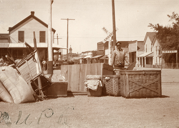 baskets, bags, boxes piled in street