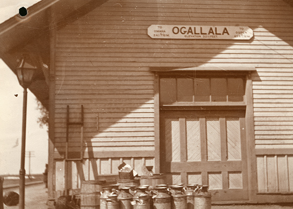 outside of depot with sign and barrels