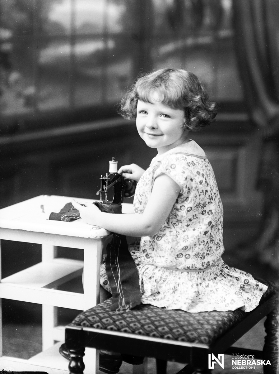 Jo Ann Grimes with toy sewing machine, 1929 (RG5385.PH000029-000065)