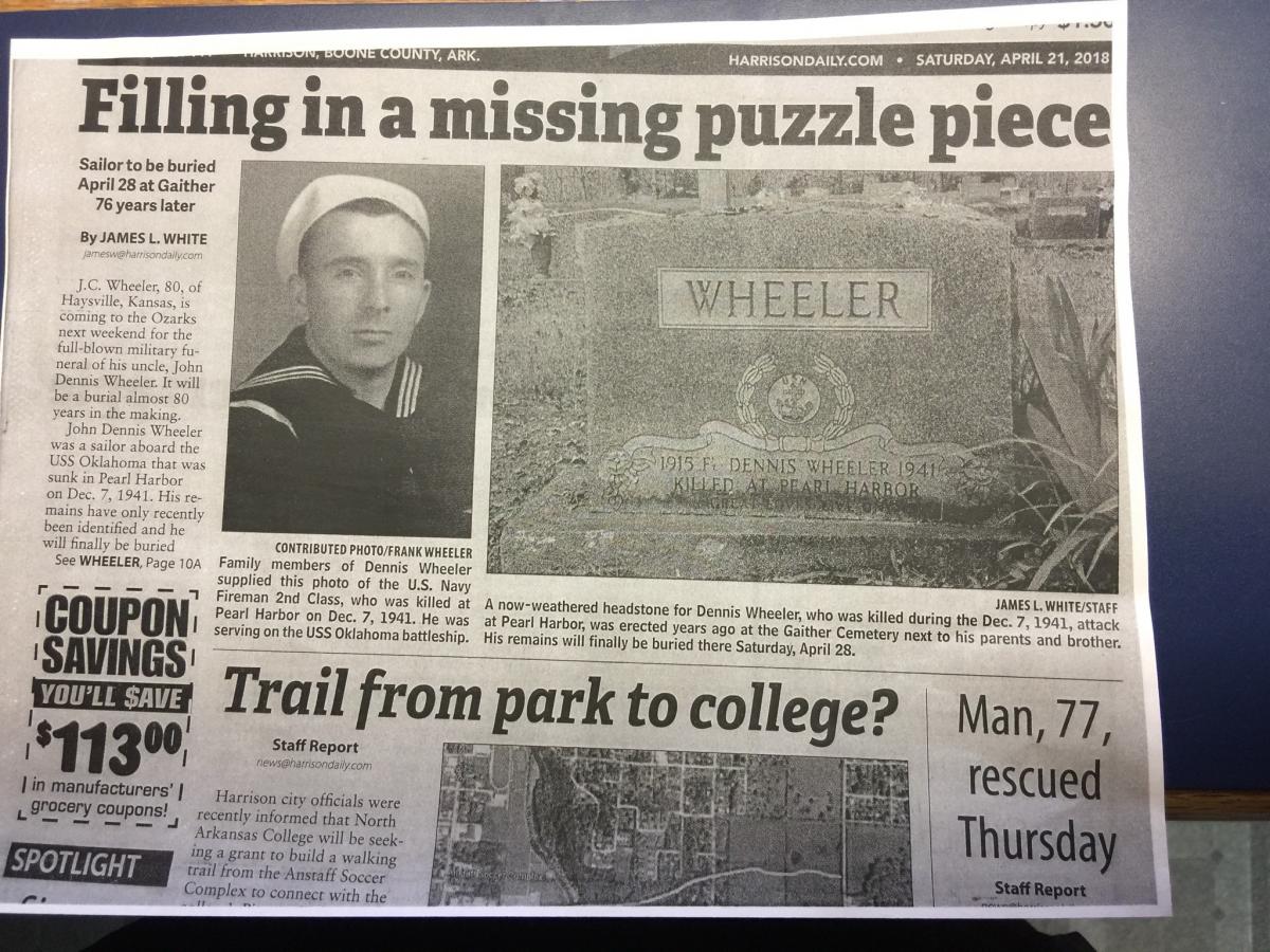 Newspaper clipping showing photo of John Dennis Wheeler and photo of headstone.
