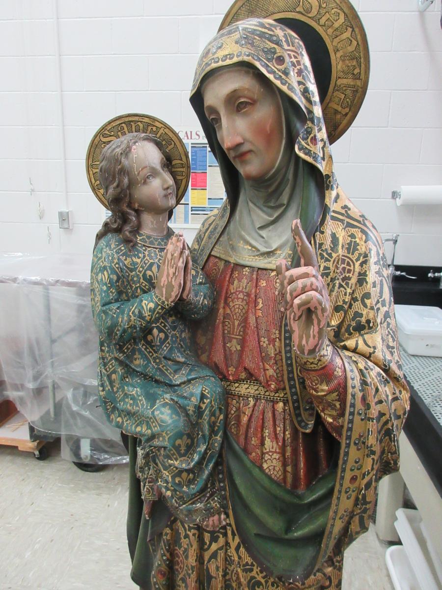 Detail photo of St Anne sculpture before treatment.
