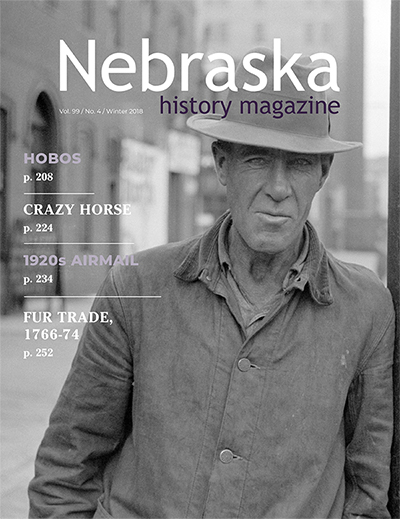 Cover of Nebraska History showing man on Douglas St., Omaha, 1938