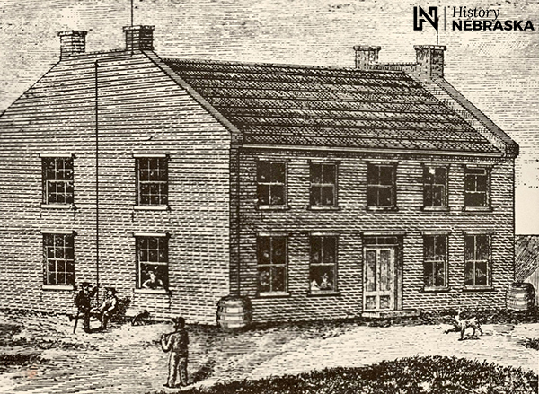 engraving of two-story brick buillding with gabled roof and four chimneys