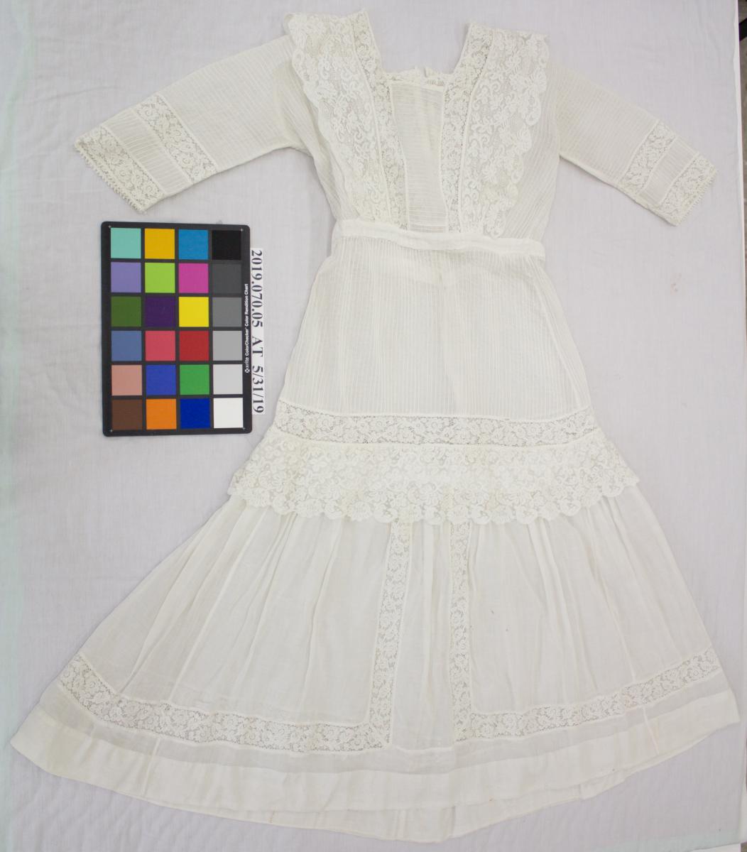 white cotton lace dress, after treatment, notably whiter