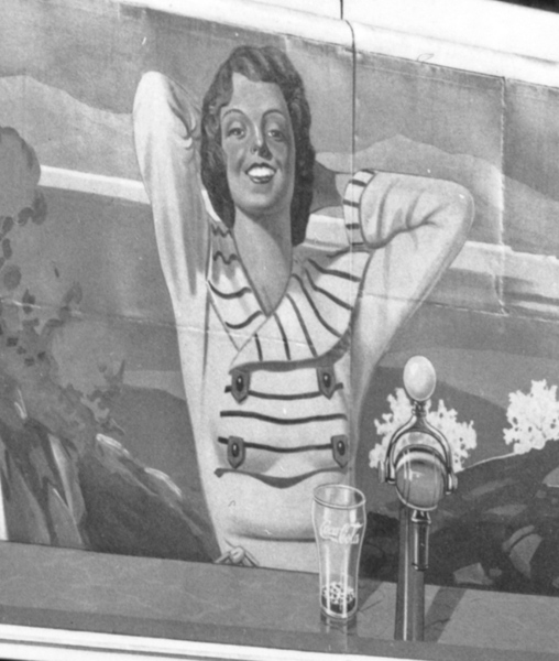Detail of the corner drug store. Painted image of a woman in an advertisement