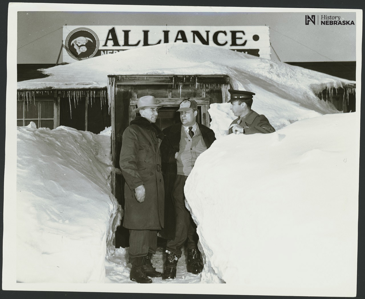 Gov. Val Peterson (center) Roberts W. Laing, City Manager, left. Blizzard of 1949