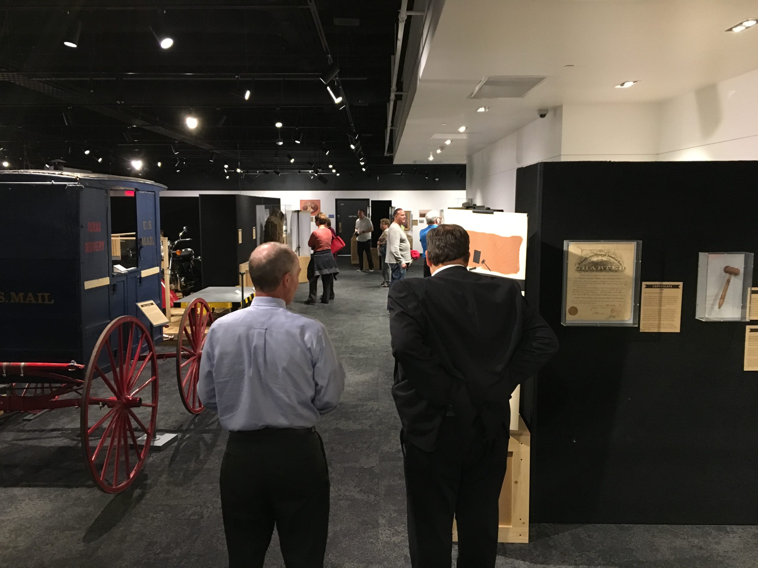 Visitors looking at museum exhibits