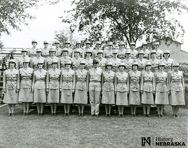 WAAC Fourth Company. Helen Sagl is in the front row, third from the right. The WAACs here are wearing an early version of the khaki uniform, which underwent many modifications. The belt, for example, was eliminated from the jacket by October 1942, because it wore out the material beneath it.