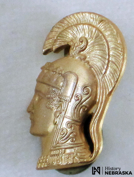 The WAAC/WAC insignia was the Greek goddess Pallas Athene. Officers wore U.S. insignia on their upper lapels, and the Pallas Athene on their lower lapels. History Nebraska 9168-4-C