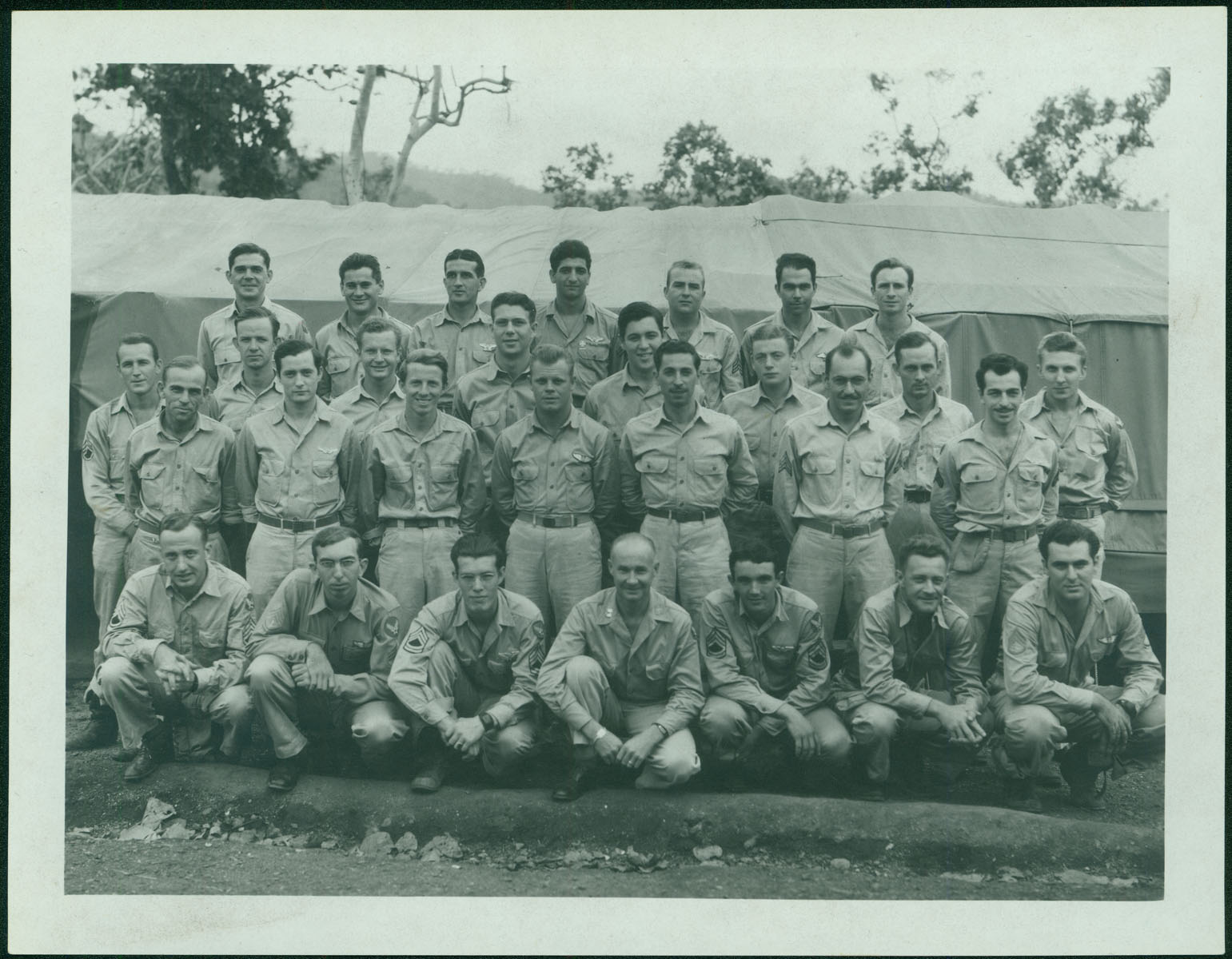 In this group photo of the 90th Bomb Group, Robert Merchant stands in the second row from the top, fourth from the left.