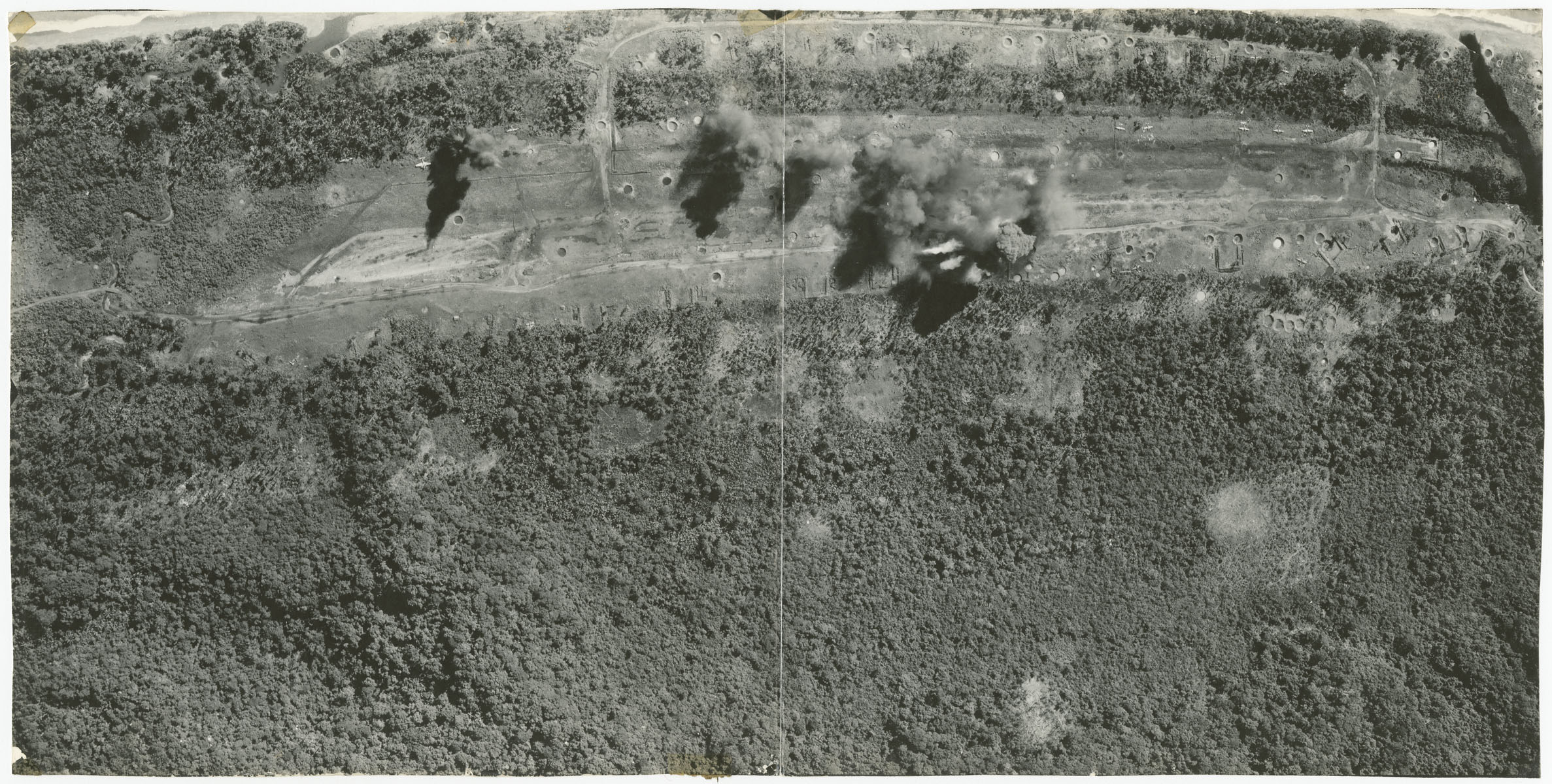 An aerial view of the bombing of the But Airdrome on the coast of New Guinea.