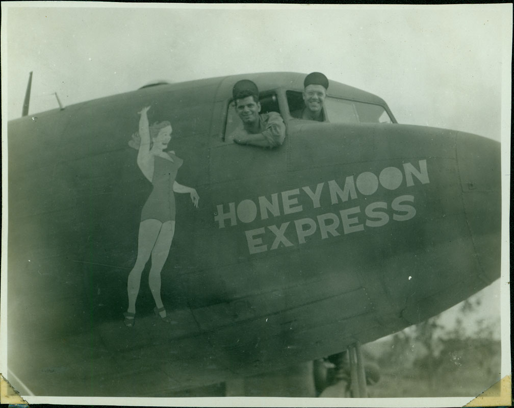 Honeymoon Express - Two men presumably assigned to this particular B-24 pose next to the artwork from the cockpit.