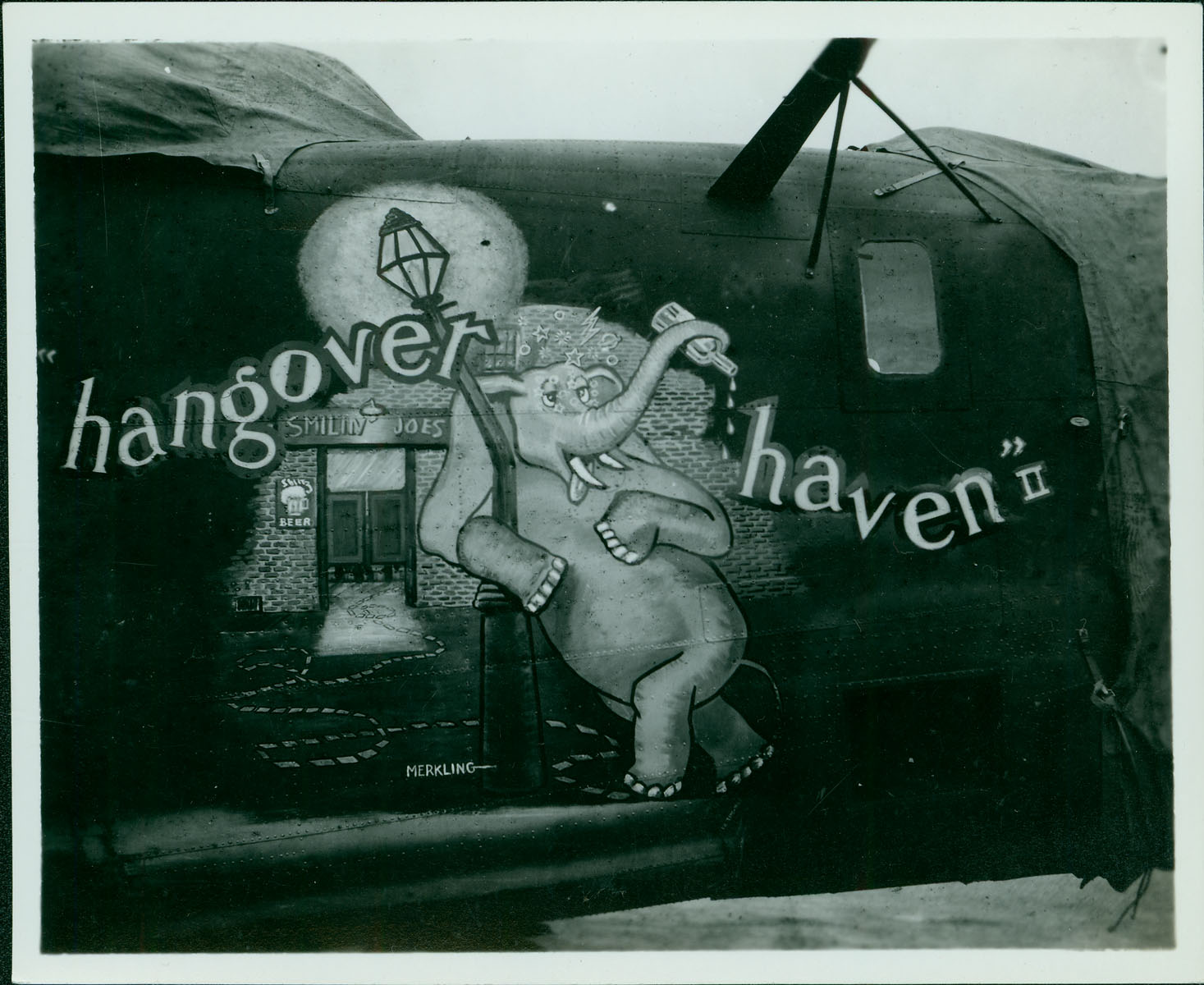 This nose art was drawn and signed by artist Al Merkling.