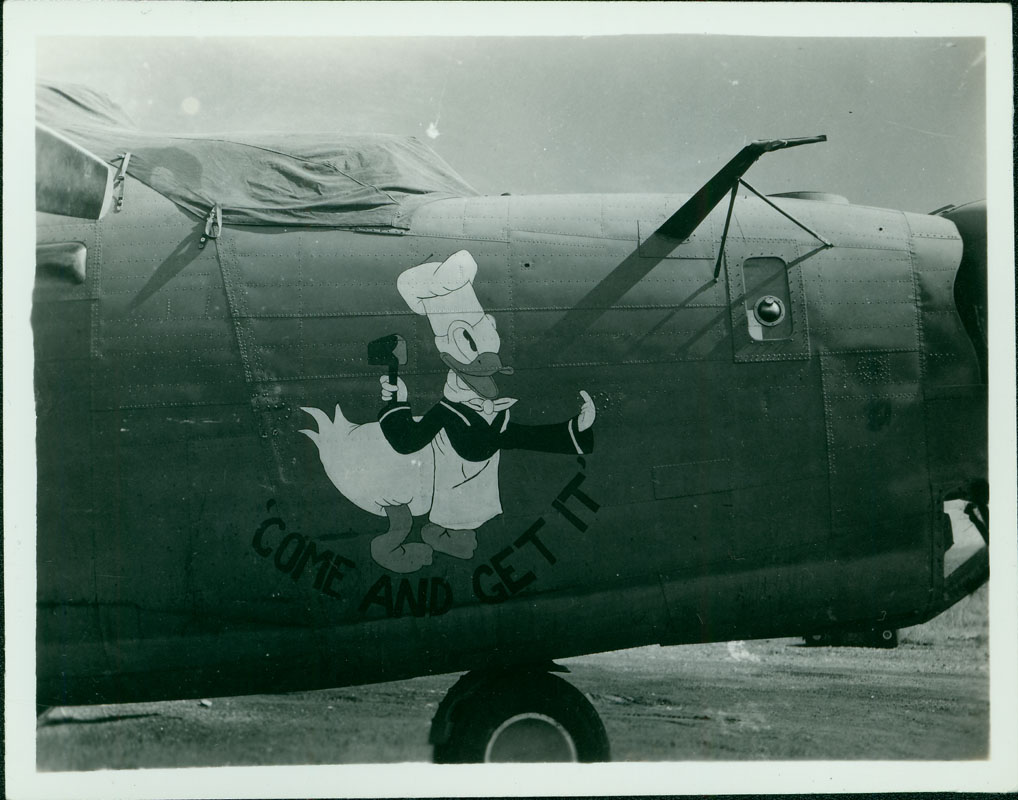 Come And Get It - Donald Duck of Disney fame is painted on this B-24. Disney cartoons were commonly used for nose art during WWII.