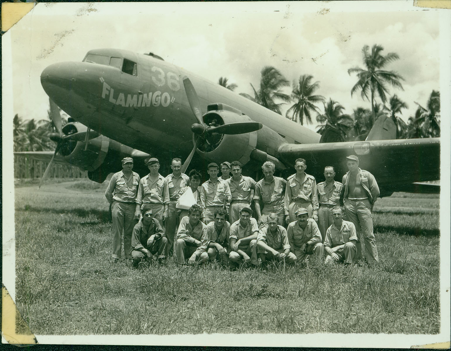 After landing, the rescue team and stranded officers pose in front of the rescue plane, the Flamingo.