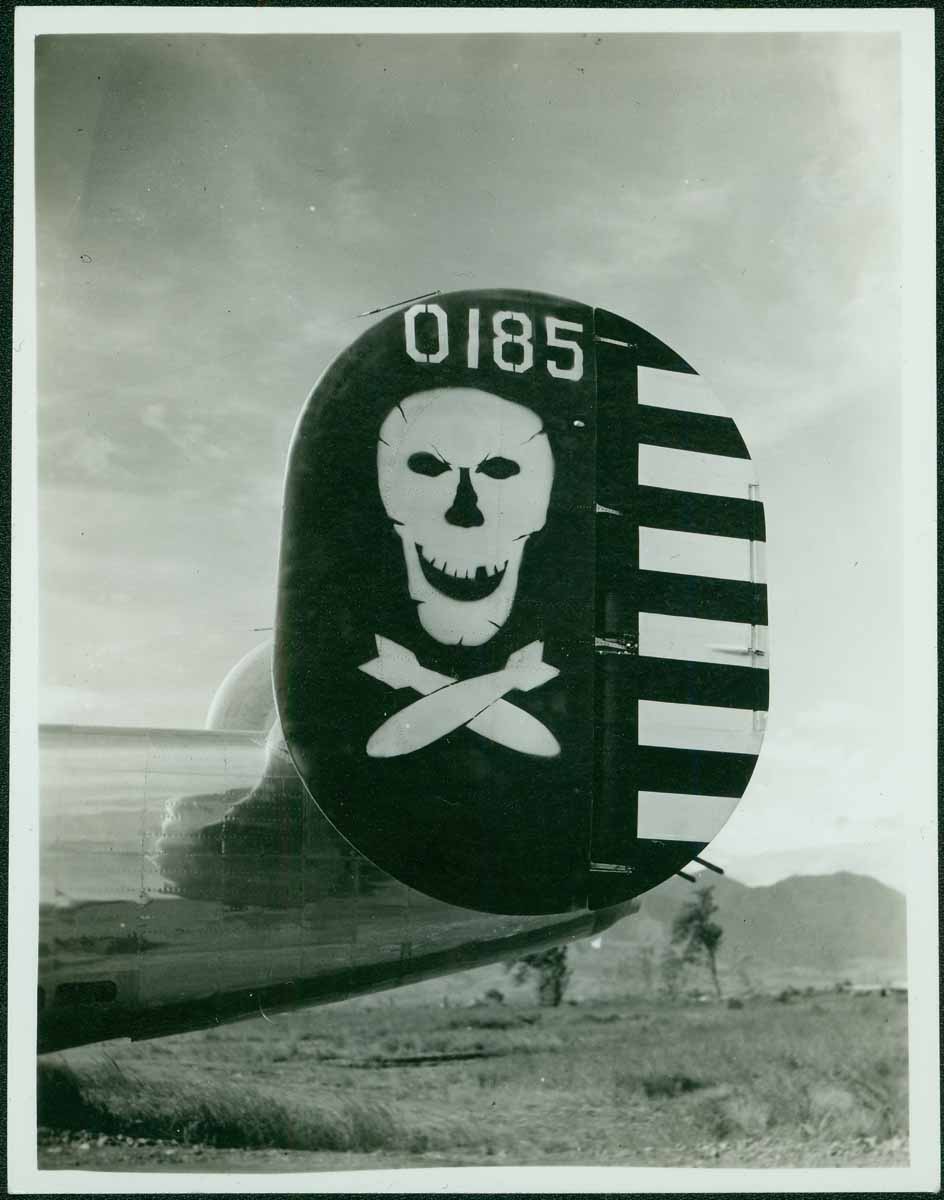 The tail fins of the B-24 Liberators flown by the 90th Bomb Group (the Jolly Rogers) all sport the skull-and-crossed-bombs insignia.