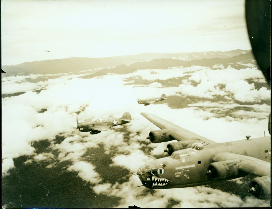 Moby Dick - The B-24 Liberator Moby Dick and four other B-24’s fly in formation above the clouds.