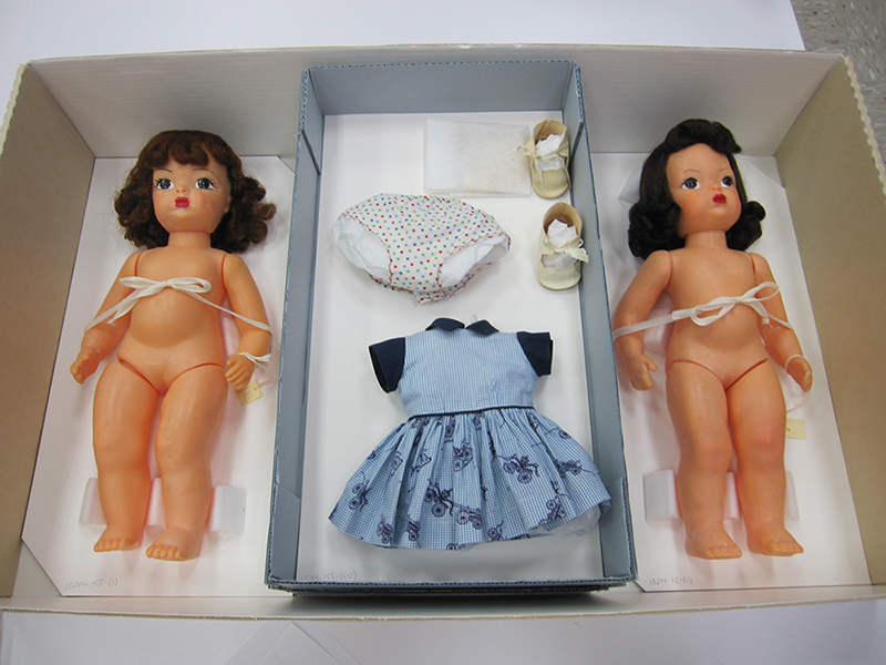 Because both dolls exhibited bloom, they could be stored together. The clothing tray for the doll on the right is below the other tray of clothing shown.