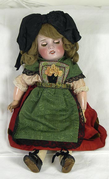 Doll (NSHS 7144-133) Sleepy-eye doll with a china head and wood body. 