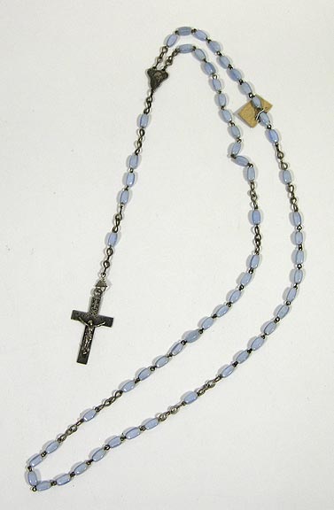 Rosary (NSHS 7144-150 ) Rosary with light blue beads and silver alloy chain and Crucifix. Rosary is 18.25" (46.3 cm) long and has "N.D. de Lourdes" inscribed on the back of the Crucifix. 