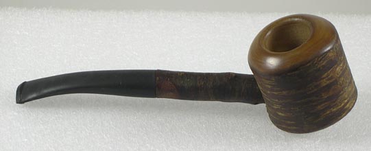 Pipe (NSHS 7144-175) Pipe with a round bowl made of turned briar. The half stem attached to the bowl is also briar. Stamped in a white oval on the bit is "ROPP." In the bottom of the bowl "Aug. Ropp" is also stamped. 