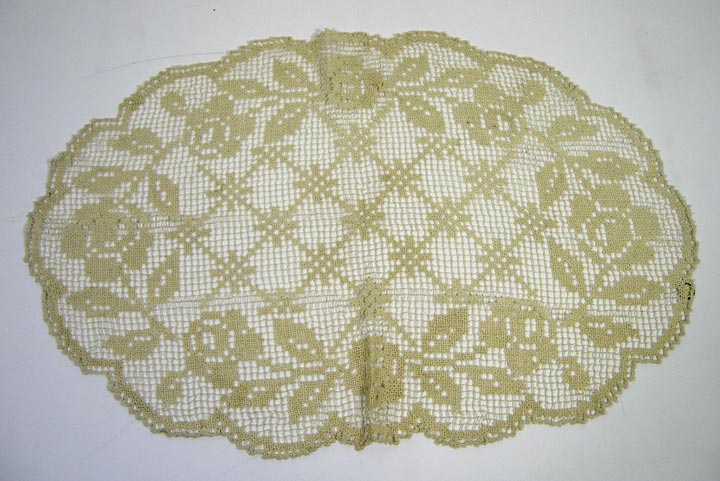 Doily (NSHS 7144-209) Doily with floral patterns.