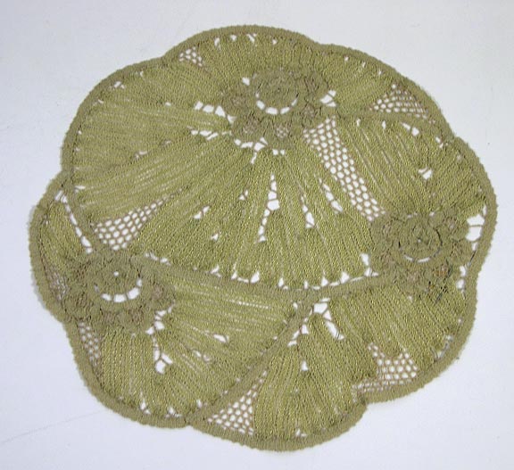 Doily (NSHS 7144-72) Doily with an off-center floral pattern. 