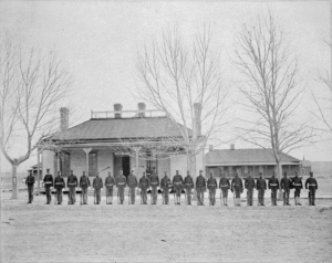 Tenth Cavalry guard detail in front of the post guardhouse, around 1905.