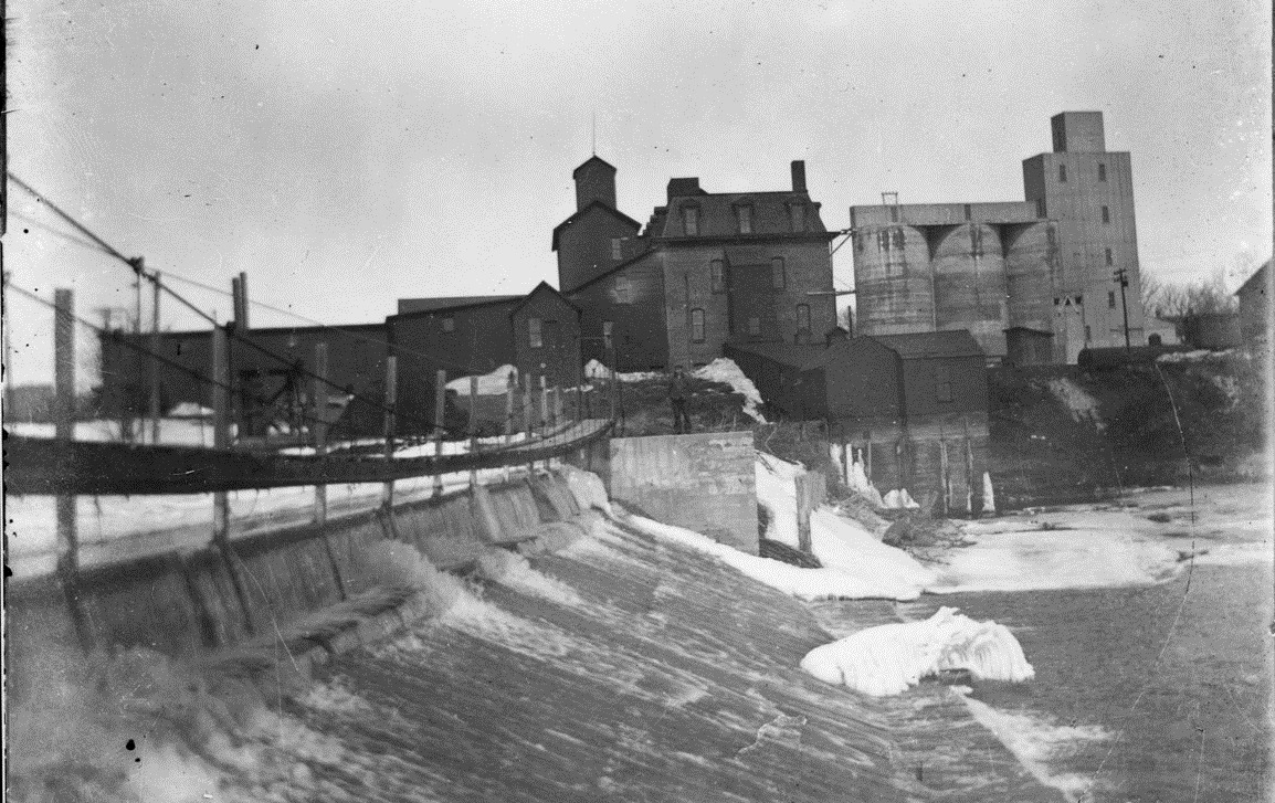 Winter view of Neligh Mill dam, about 1910.