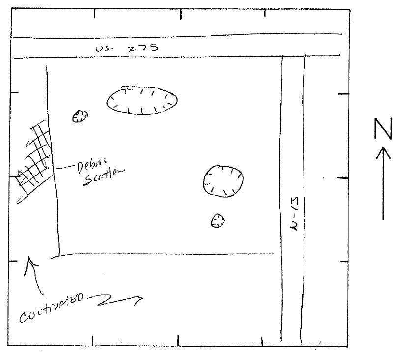 Hand-drawn map showing an area bordered by US 275 and N-15, with labeled debris scatter, objects, cultivated field, and a north arrow for orientation.