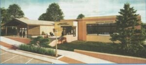 Rendering of a building labeled "Cass County Historical Society" with a "Memorial Addition" section, surrounded by trees and a parking lot in the foreground.
