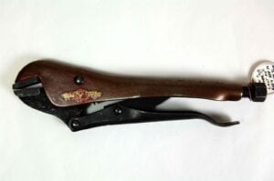 A set of vice grips with a brownish handle and adjustment screw, photographed on a plain white background.